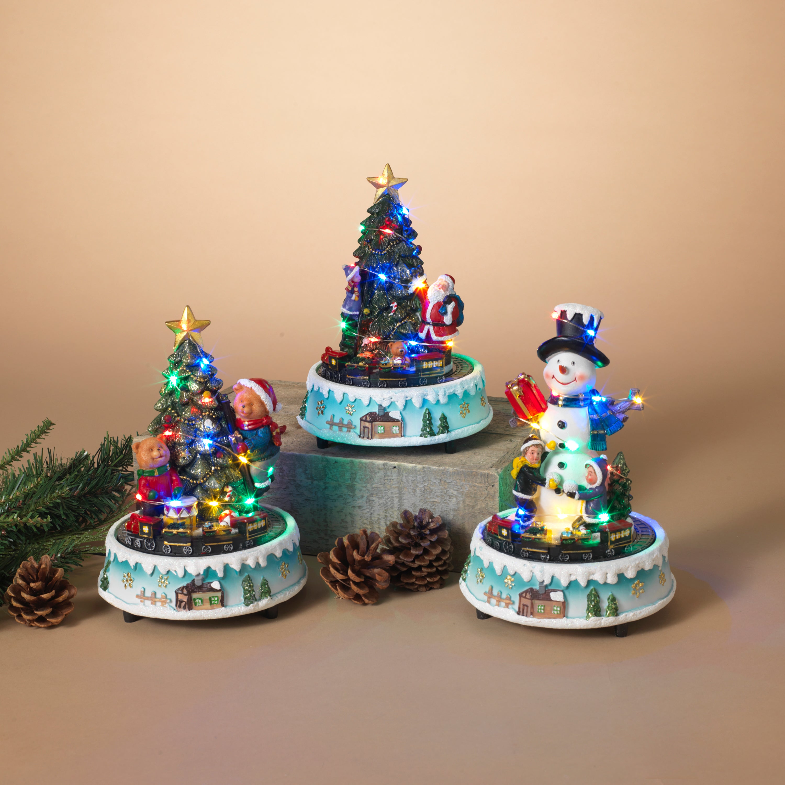 Set of 3 Light-Up Musical Trains with Snowman and Trees